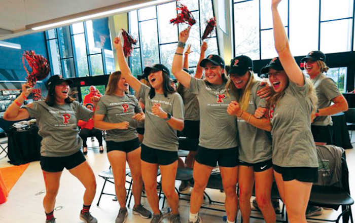 The Princeton softball team celebrates finding out it will open regionals against No. 4 seed Arkansas in the Fayetteville Regional.